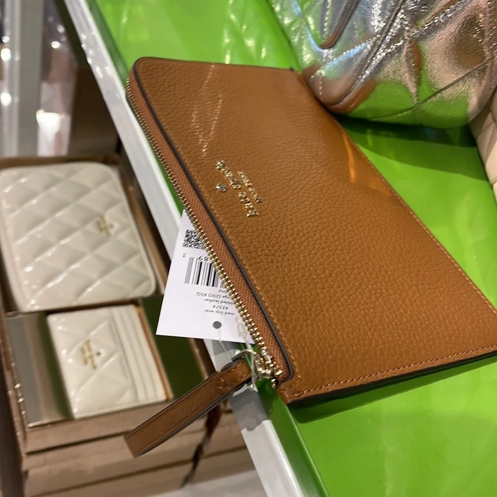 Kate Spade Medium Lucy L-Zip Wristlet Pebble Leather 

Warm Gingerbread 
NWT - Picture 6 of 16